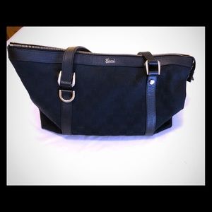 Black canvas Gucci bag.